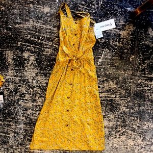 A mustered colored dress and shirt